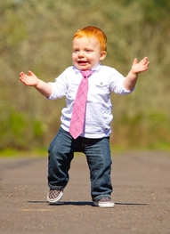 Baby in Business dress stepping