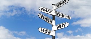 Directional sign with who, what, where, when, why and how