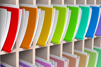 colored file folders lined up on a shelf